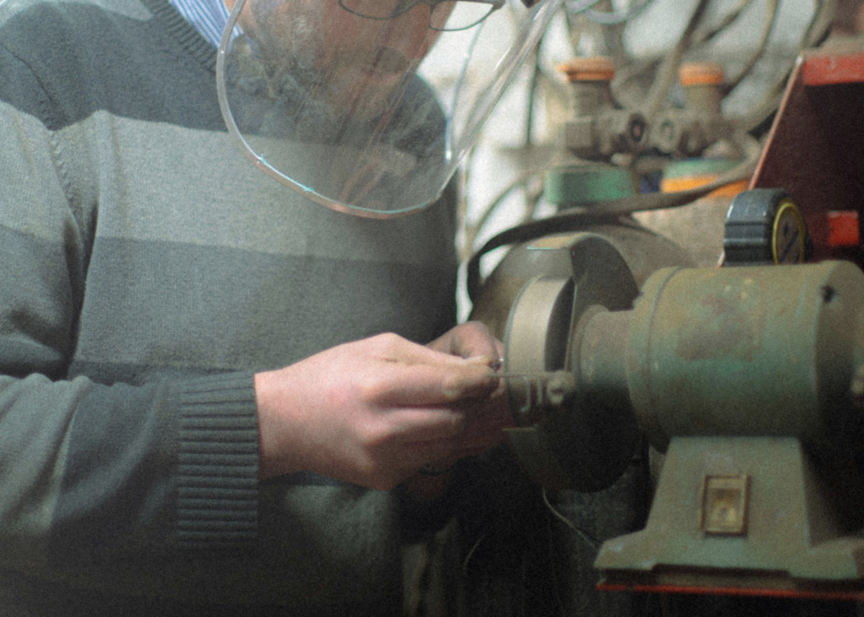 Person working on a lathe in a workshop